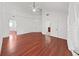 Large main bedroom with hardwood floors and double doors leading to the bathroom at 315 Wooten Rd, Lutz, FL 33548