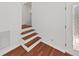 Elegant staircase with hardwood steps and white risers leading to upper level at 315 Wooten Rd, Lutz, FL 33548