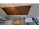 Attic access in garage with visible storage space above shelving at 3436 100Th N Ave, Pinellas Park, FL 33782