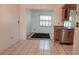 Bright dining area featuring tile floors, stainless steel dishwasher, and shuttered windows at 3436 100Th N Ave, Pinellas Park, FL 33782