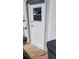 White exterior door with window pane and security screen, located on the side of the house at 3436 100Th N Ave, Pinellas Park, FL 33782