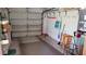 Spacious garage with ample storage, shelving, and a roll-up garage door at 3436 100Th N Ave, Pinellas Park, FL 33782