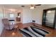 Inviting living room featuring parquet floors, ceiling fan, and seamless access to the kitchen at 3436 100Th N Ave, Pinellas Park, FL 33782