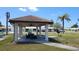 Community outdoor pavilion with picnic tables and grill, great for gatherings and outdoor dining at 3436 100Th N Ave, Pinellas Park, FL 33782