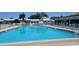 Outdoor community pool with lounge chairs, offering a refreshing place to relax and socialize at 3436 100Th N Ave, Pinellas Park, FL 33782