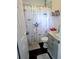 Cozy bathroom featuring a dragonfly shower curtain, marble vanity, and tile accents at 37654 Eiland Blvd, Zephyrhills, FL 33542