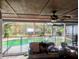 Enclosed lanai overlooking backyard pool, offering seamless indoor-outdoor living and entertaining at 37654 Eiland Blvd, Zephyrhills, FL 33542