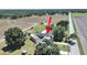 Aerial view of property, highlighting the home's layout with adjacent fields at 3908 N Forbes Rd, Plant City, FL 33565