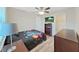 Comfortable bedroom features wood-look floors, a ceiling fan, closet, and ample space at 3908 N Forbes Rd, Plant City, FL 33565