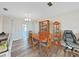 Cozy dining area with wood table and chairs is filled with natural light at 3908 N Forbes Rd, Plant City, FL 33565