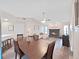Inviting living space with cozy fireplace flows seamlessly from the dining area at 3908 N Forbes Rd, Plant City, FL 33565