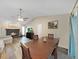 Comfortable living space with fireplace flows seamlessly from dining area at 3908 N Forbes Rd, Plant City, FL 33565