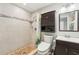 Bathroom featuring tiled shower with glass door, vanity, and neutral decor at 4091 Cherry Ne St, St Petersburg, FL 33703