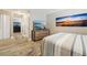 Bedroom featuring a large TV and a comfortable striped bed at 4091 Cherry Ne St, St Petersburg, FL 33703