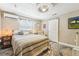 Cozy bedroom featuring a ceiling fan, artwork, and comfortable furnishings at 4091 Cherry Ne St, St Petersburg, FL 33703