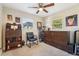 Bedroom featuring a modern murphy bed and chair with natural light from two windows, perfect for a home office at 4091 Cherry Ne St, St Petersburg, FL 33703