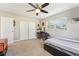Bedroom with a ceiling fan, large closet, and window featuring a built-in desk, ideal for work or study at 4091 Cherry Ne St, St Petersburg, FL 33703