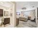 Cozy bedroom with a ceiling fan, artwork, comfortable furnishings and en-suite bathroom at 4091 Cherry Ne St, St Petersburg, FL 33703