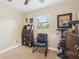 Bedroom featuring a modern murphy bed and chair with natural light from window, perfect for a home office at 4091 Cherry Ne St, St Petersburg, FL 33703