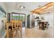 Eat-in kitchen with stainless steel appliances, a breakfast table, a ceiling fan, and a sliding glass door at 4091 Cherry Ne St, St Petersburg, FL 33703