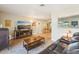 Cozy living room with wood floors, comfortable seating, and a view into the dining area at 4091 Cherry Ne St, St Petersburg, FL 33703