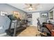 Dual-purpose office space featuring wood-look tile, a treadmill, and workspace for working from home at 4091 Cherry Ne St, St Petersburg, FL 33703