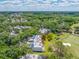 Aerial view of a condo community next to a golf course surrounded by trees at 4212 Fairway Cir, Tampa, FL 33618