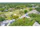 Stunning aerial view of property overlooking a lush golf course and green landscape in a quiet neighborhood at 4212 Fairway Cir, Tampa, FL 33618