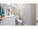 Well-lit bathroom with a vanity, toilet, and neutral decor at 4212 Fairway Cir, Tampa, FL 33618
