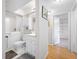 Clean bathroom showing a walk-in bathtub, vanity, and storage space that offers safety and convenience at 4212 Fairway Cir, Tampa, FL 33618