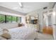 Bright bedroom featuring a large window, light colored walls and flooring, and ample space for furniture at 4212 Fairway Cir, Tampa, FL 33618