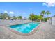 Community pool surrounded by lush greenery, creating a serene and private oasis for residents to enjoy at 4212 Fairway Cir, Tampa, FL 33618