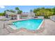 Inviting community pool with sun loungers, tables, and umbrellas, offering a perfect spot for relaxation at 4212 Fairway Cir, Tampa, FL 33618