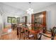 Dining room with a chandelier, a wall mirror, a display case, and a view of the outdoors at 4212 Fairway Cir, Tampa, FL 33618