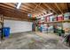 Spacious garage featuring a side door and shelving along the back wall for ample storage at 4212 Fairway Cir, Tampa, FL 33618