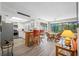Open-concept kitchen with stainless steel appliances, a center island, and an adjacent dining area at 4212 Fairway Cir, Tampa, FL 33618