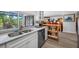 Kitchen with stainless steel dishwasher and a view to the living room at 4212 Fairway Cir, Tampa, FL 33618