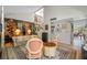 Charming living room with decorative accents, comfortable seating, and a view of the staircase at 4212 Fairway Cir, Tampa, FL 33618