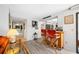 Open-concept living space with bar seating adjacent to the kitchen area at 4212 Fairway Cir, Tampa, FL 33618