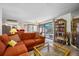 Bright living room with lanai access and comfortable seating arrangements at 4212 Fairway Cir, Tampa, FL 33618