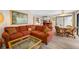 Comfortable living room with view of the kitchen and access to the lanai at 4212 Fairway Cir, Tampa, FL 33618