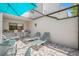 Charming patio with outdoor seating, lounge chairs, and bar area for relaxing and entertaining at 4212 Fairway Cir, Tampa, FL 33618