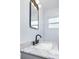 Updated bathroom featuring a new vanity with granite counters and a modern faucet at 4719 Ohio Ave, Tampa, FL 33616
