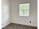 This room has a window that provides natural light and hardwood floors at 5118 Tennis Court Circle, Tampa, FL 33617
