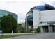 Modern architectural building featuring a blue dome, glass windows, and green landscape at 5118 Tennis Court Circle, Tampa, FL 33617