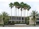University of South Florida building exterior featuring tall palm trees and signage at 5118 Tennis Court Circle, Tampa, FL 33617