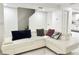 Bright living room with white tile flooring, staircase, and comfy sectional sofa at 5118 Tennis Court Circle, Tampa, FL 33617