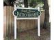 Temple Terrace Patio Homes community sign with green and gold lettering; community living at 5118 Tennis Court Circle, Tampa, FL 33617