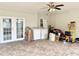 Spacious utility room with washer, dryer, French doors, and plenty of storage space at 5118 Tennis Court Circle, Tampa, FL 33617