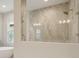 Spa-like shower with a glass door and a separate soaking tub in the bathroom at 5152 Wildwind Dr, Apollo Beach, FL 33572